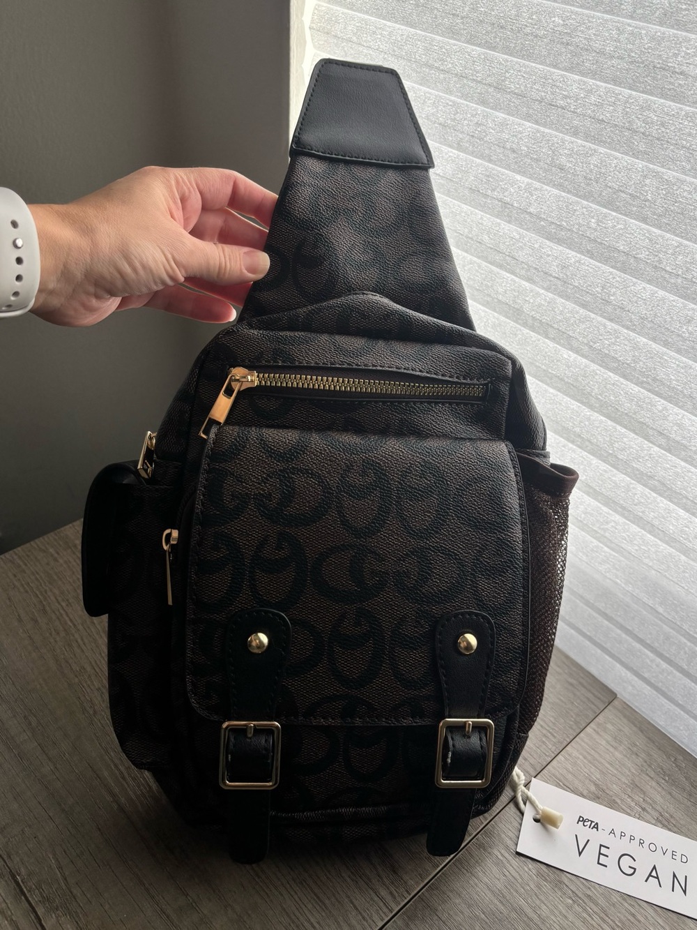 Brown Sling Backpack with Signature Pattern